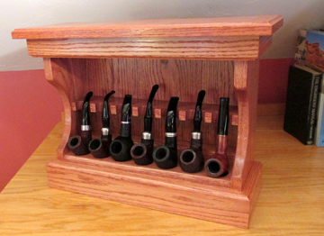 Front view of a Haunted Bookshop smoking pipe rack made from woodworking plans.