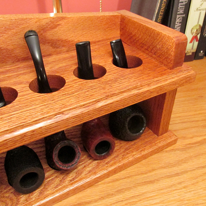 Front right close up of a an 8 smoking pipe rack for the mantel