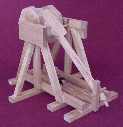 Back view of a tapletop trebuchet in the cocked postion showning the sling and release