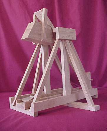 Side view of a working scale model trebuchet in the cocked positon showing the hinged counterweight.