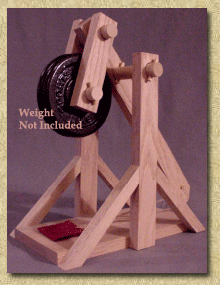 Side view of a working model trebuchet kit in the cocked position.