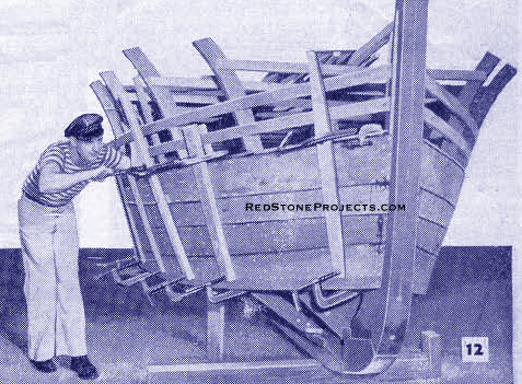 Figure 12. Picture of a sailor attaching the hull planking to the ribs of a boat.