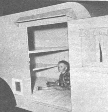 Interior view of the camp trailer shows bunk arrangement. Although not overly spacious, it will sleep a small family.