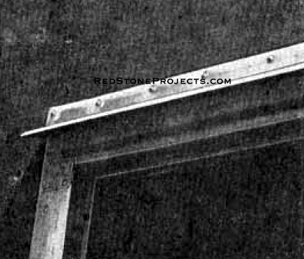 Photo 6. Aluminum strips are screwed around all raw edges of door, frame, and body. Drip molding is bent and fastened above as shown.