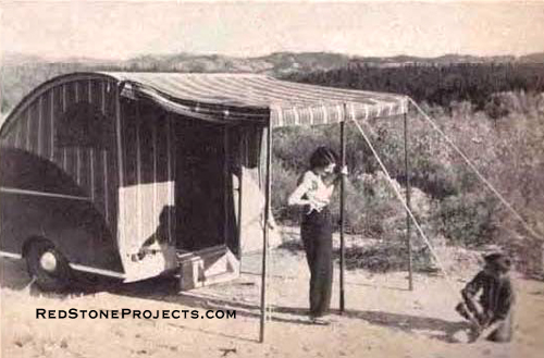 Picture of a woman and boy setting up the awning on an open Wild Goose Kamp Master trailer.