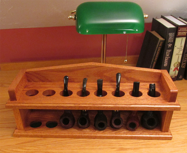 Top front view of a handmade tobacco pipe rack