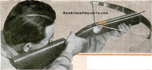 Man aiming a steel spring crossbow.