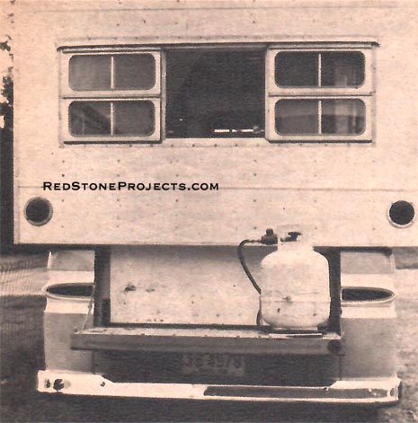 CAMPER rear view showing position of tank on tailgate to comply with laws. Windows are fitted with screens.