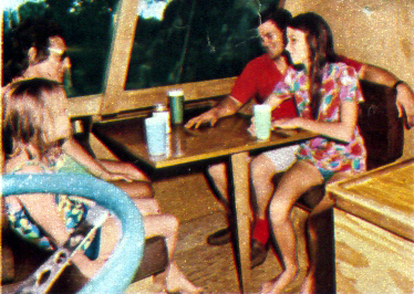 DINING table seats four, then drops flush with  seats to form an extra bunk inside.