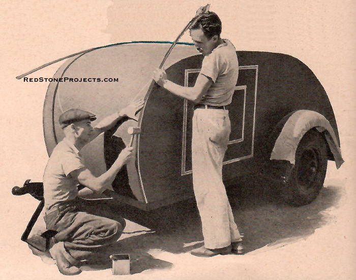 Aluminum molding being tacked over the trailer's corners to give the finished job an attractive appearance.