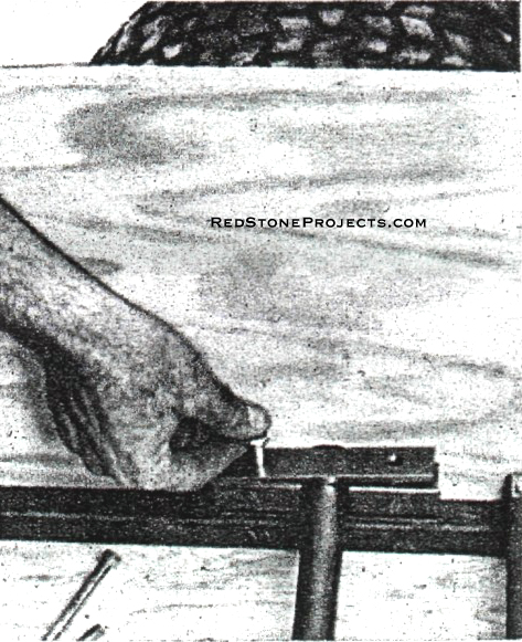 STEEL STRAPS on square steel tubing spacers hold dead axles securely in place. Outboard chains make the dead axles possible.