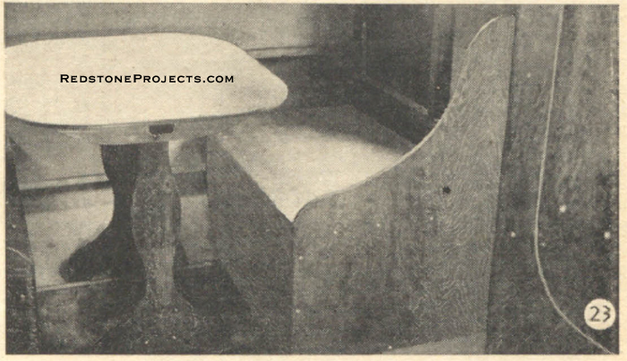 Fig. 23. Close-up of dinette made up for meal times. Cushions have been removed to show construction. Ample space is provided to seat four persons at once.