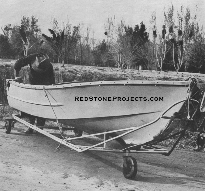 Bow wheel is detachable, its 3/4-in. shank with offset fork swivels inside a reamed-out 3/4-in. pipe coupling welded to the front cross-member. Boat bow rests against a 1/4-in. x 3-in. flat bar strip padded with scrap carpeting.