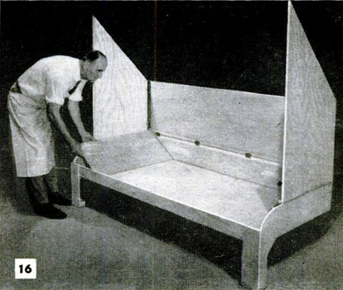 Demonstrating the bunk setup in a vintage trailer slideout.