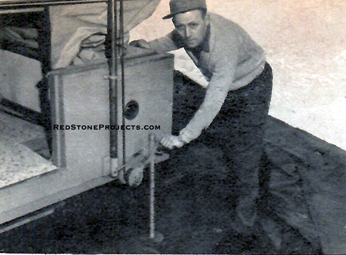 ONE operation, the turning of the winch, raises roof and unfolds walls of canvas.