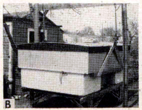 Folding trailer house lifted off a utility trailer using a trestle and jacks.