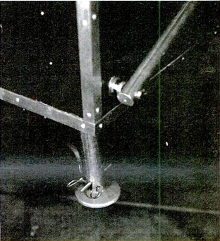 Retracted jack is locked for travel by means of a slot that prevents unscrewing and by off-center pin hole. Support tube is shown in folded position, with top down for travel.
