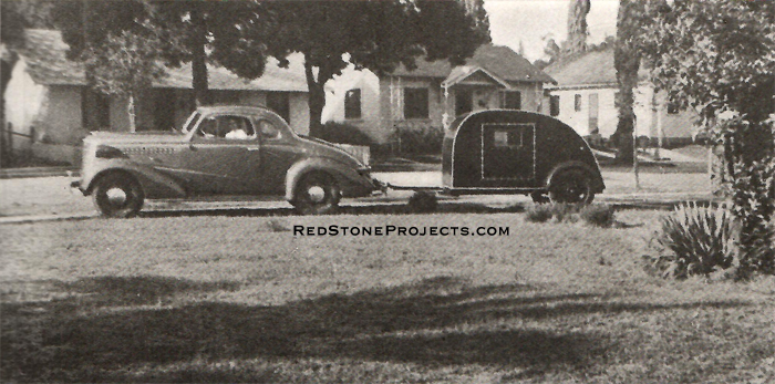 Note tiny proportions of the Honeymoon House Trailer compared to the modern car. The exterior is varnished.