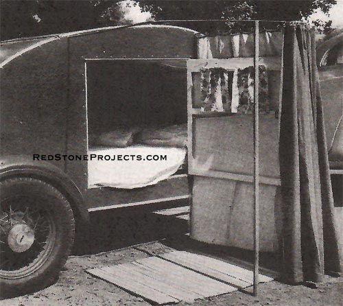 Two rods, pulled out from the trailer body, along with a third rod, support the curtains forming the dressing room. Note handy â€œroll upâ€ wooden â€œrugâ€ on the ground.