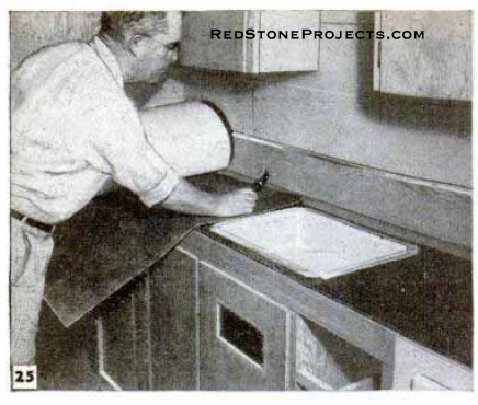 Installing travel trailer countertops.