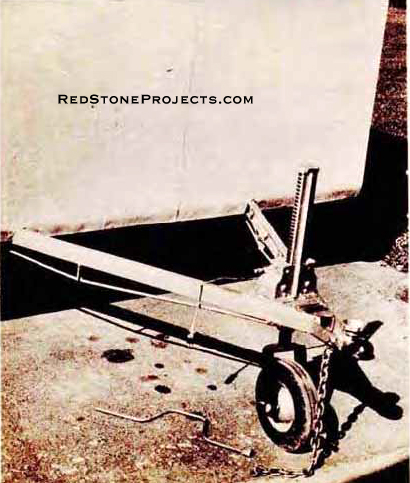 Front under-frame is notched to accept trailer tongue. Note safety chain and connector plug.
