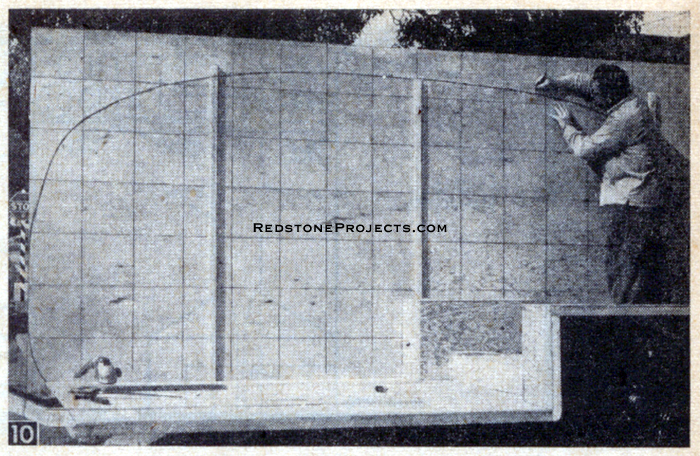 With side wall temporarily held in position on trailer chassis, check curved outline for head room and where it joins floor.