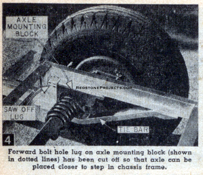 Forward bolt hole lug on axle mounting block (shown in dotted lines) has been cut off so that the axle can be placed closer to step in chassis frame.