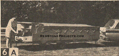 Figure 6A. With a Tent Trailer, you can even have the luxury of one of Mom’s meals while you’re still on the way to the camp ground. Just pull off the road, open the cooking cabinet (A), and let down the table leaf  - nothing to untie and fold up.