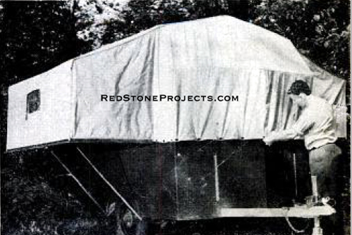 Jim Kendall buttons canvas to row of regular curtain fasteners which are added to the front of the trailer.