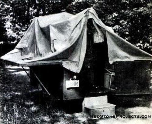 Pipe framework swing upward from the trailer body to support tent roof like Covered wagon. Steps under body keep trailer from tipping.