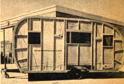 Photo of the left side frame assembly and interior wall of a canned ham trailer.