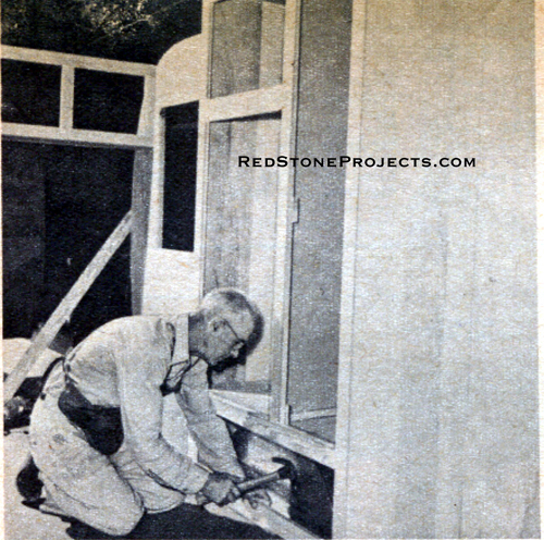 Photo of man building the clothes closet and refridgerator enclosure for a canned ham trailer.