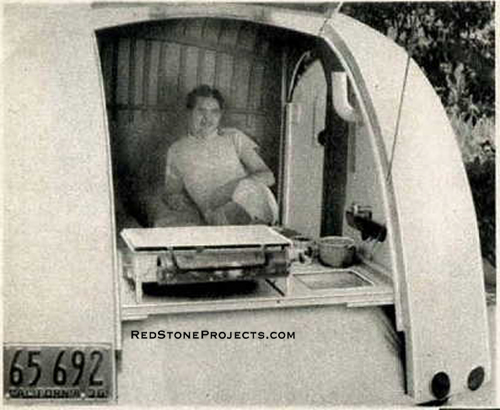 Picture through the open galley hatch of the compact, lightweight Runlite travel trailer.