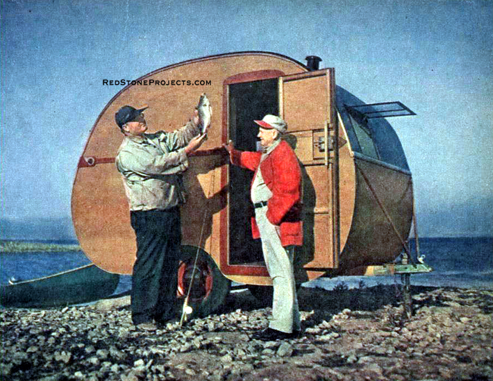 Picture of two sportsmen outside a homebuilt vacation trailer with sleeping and storage facilities.